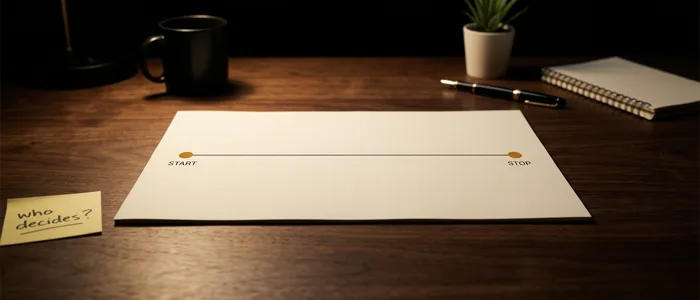 A cream page on a dark desk carrying a long horizontal timeline with a marked point at each end and the stretch between them left blank, a yellow sticky note at the desk edge reading who decides.